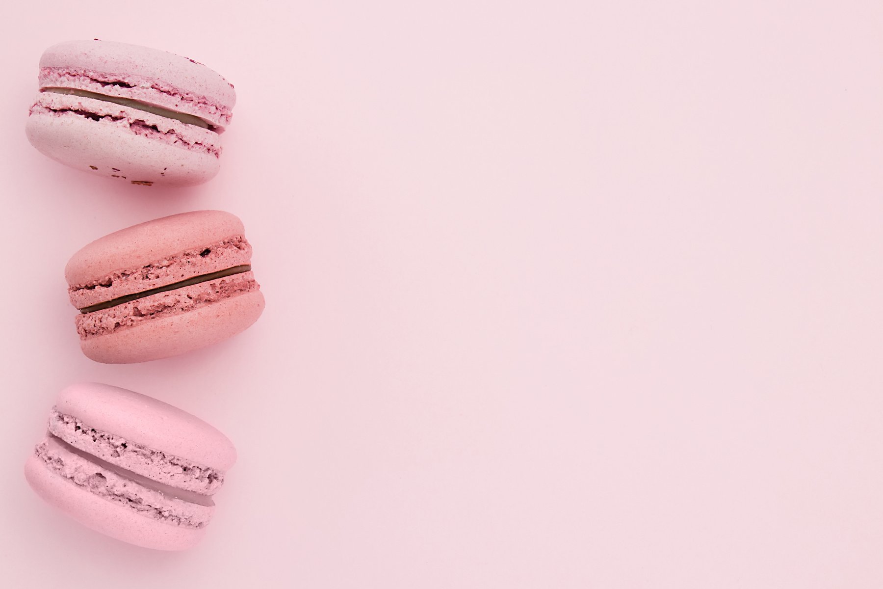 Pink macaroons on a flat lay with copy space